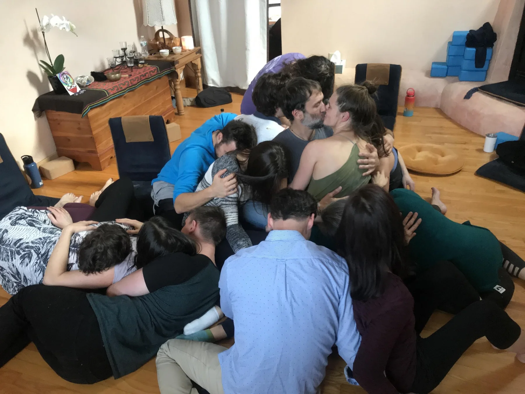 A HeartWise circle in a heap of hugs on a living-room floor