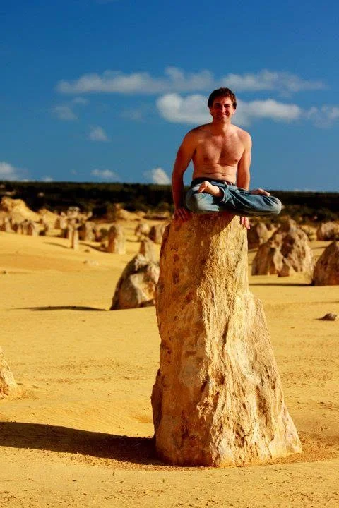 Sitting on top of a limestone pinnacle in the Pinnacles desert